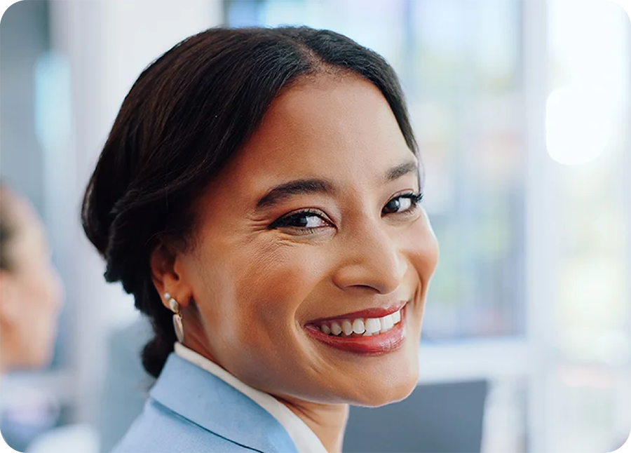 A portrait of a woman in a blue collared top