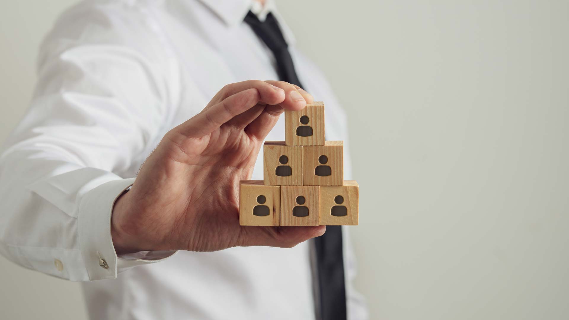 man holding building blocks